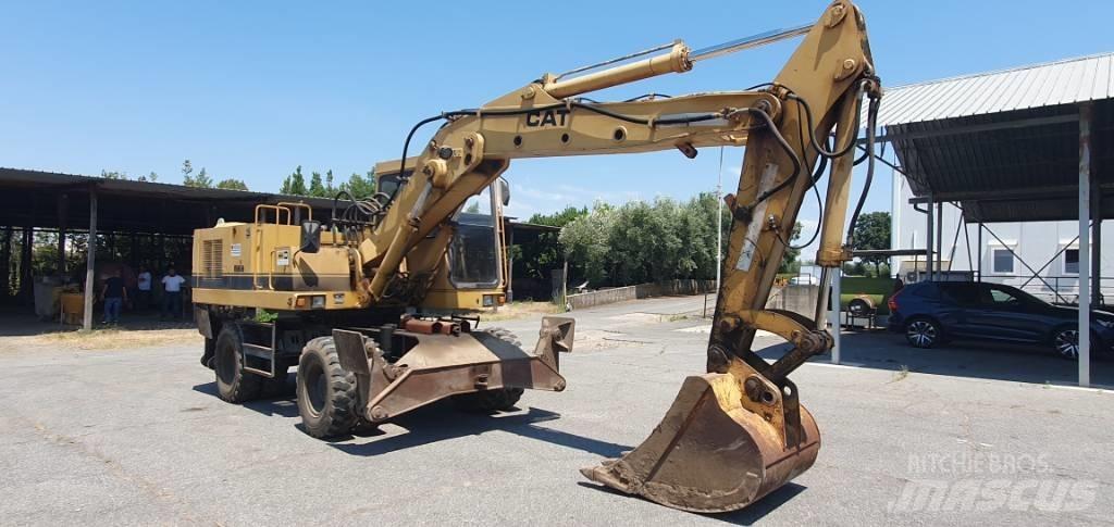 CAT 214 B Колесни екскаватори