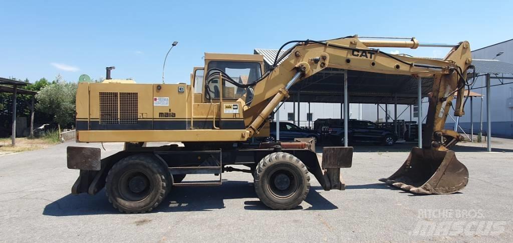 CAT 214 B Колесни екскаватори
