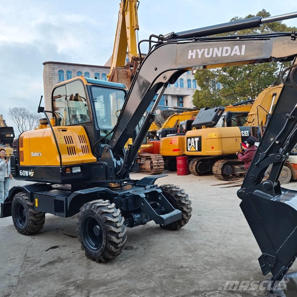Hyundai 60 W VS Колесни екскаватори