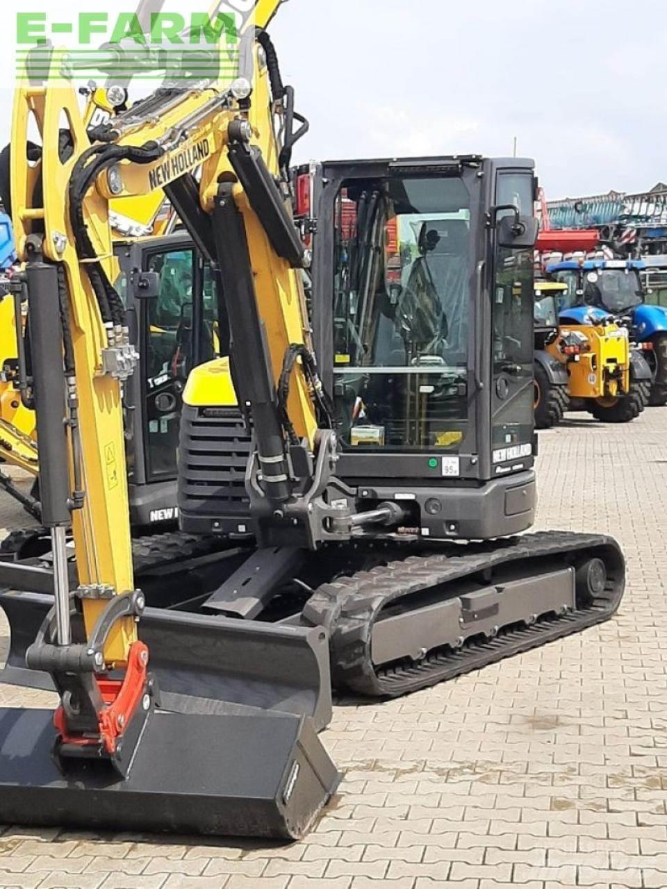 New Holland e65d Колесни екскаватори