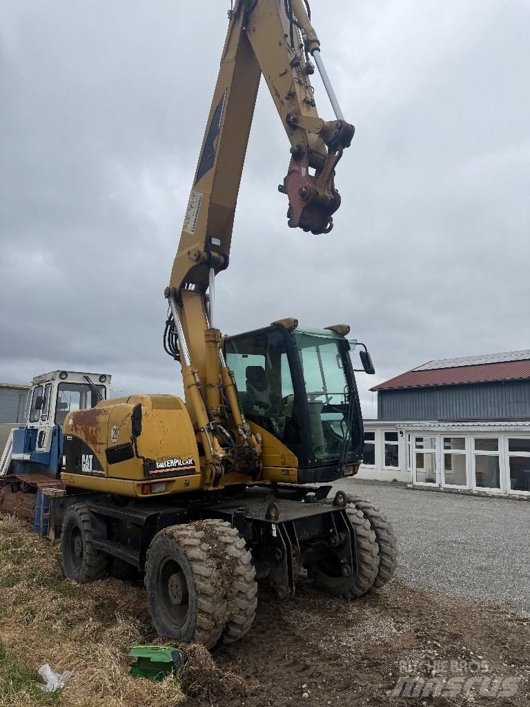 CAT M 313 C Колесни екскаватори