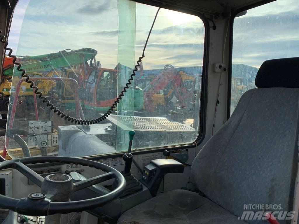 Takeuchi TB070W Колесни екскаватори
