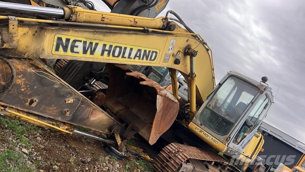 New Holland E 215 B Стрели и рамена
