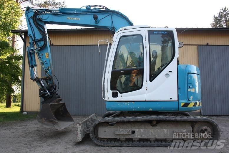  New Hollan E 70 BSR Средни екскаватори 7т - 12т