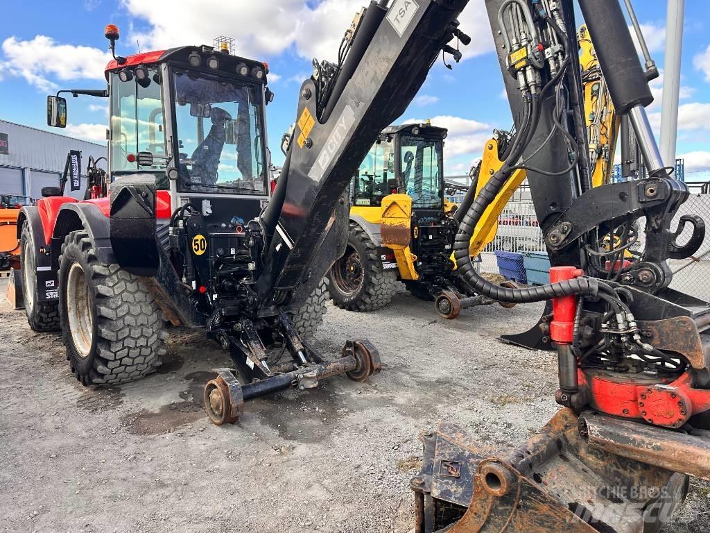 Huddig 1260 C Товарач със заден ексватор