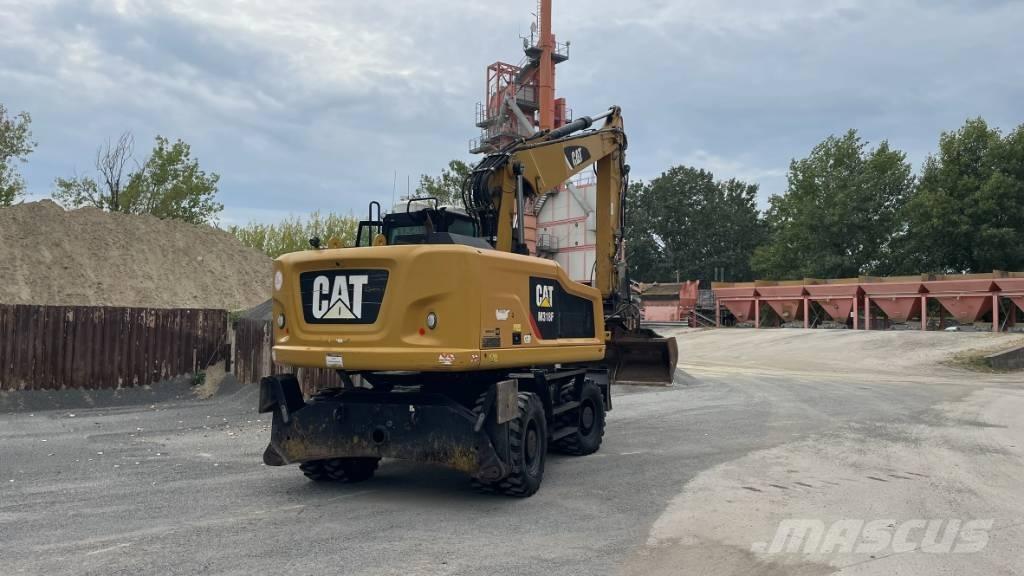 CAT M 318 F Товарач със заден ексватор