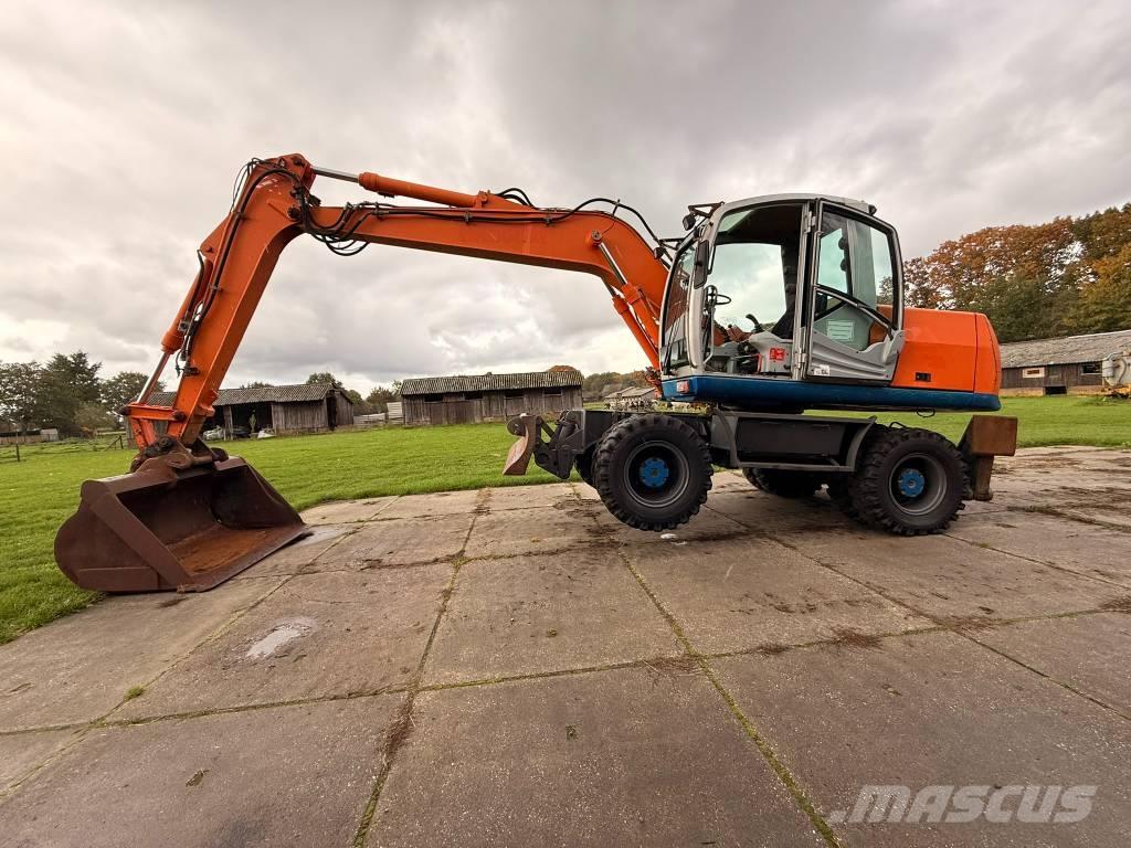 Atlas terex Екскаватори