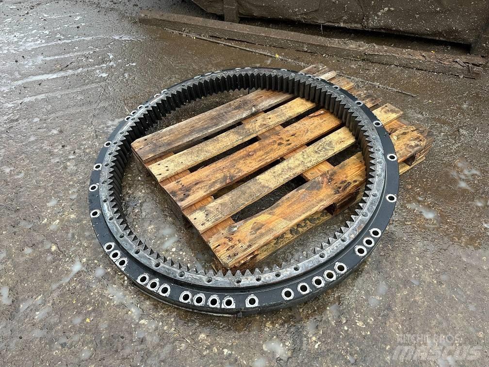 CAT 323 slew ring Оси
