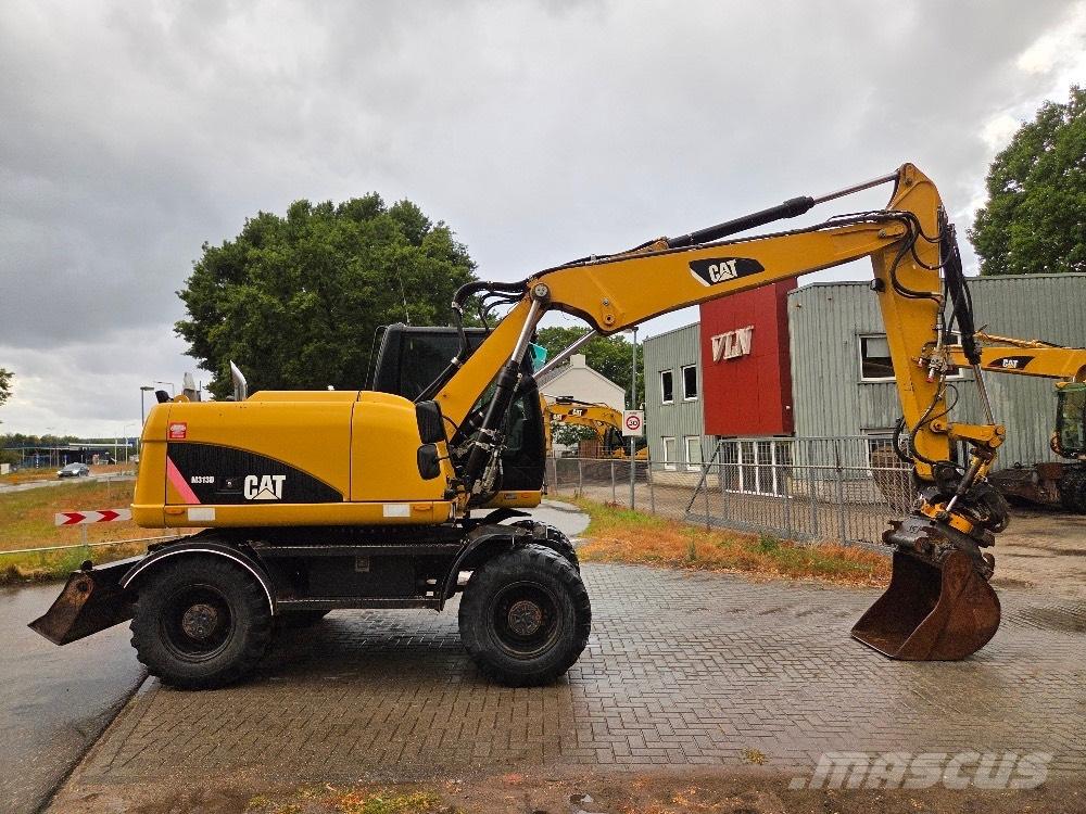 CAT M313D Колесни екскаватори