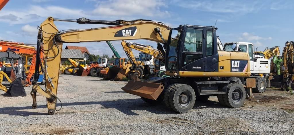 CAT M 315 D Колесни екскаватори