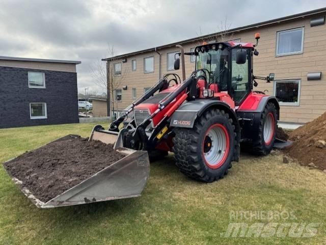 Huddig 1260 C Товарач със заден ексватор