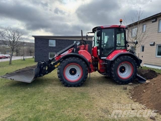 Huddig 1260 C Товарач със заден ексватор