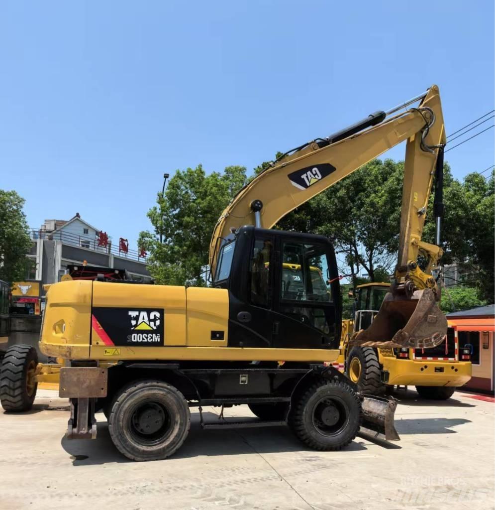 CAT M 320 Колесни екскаватори