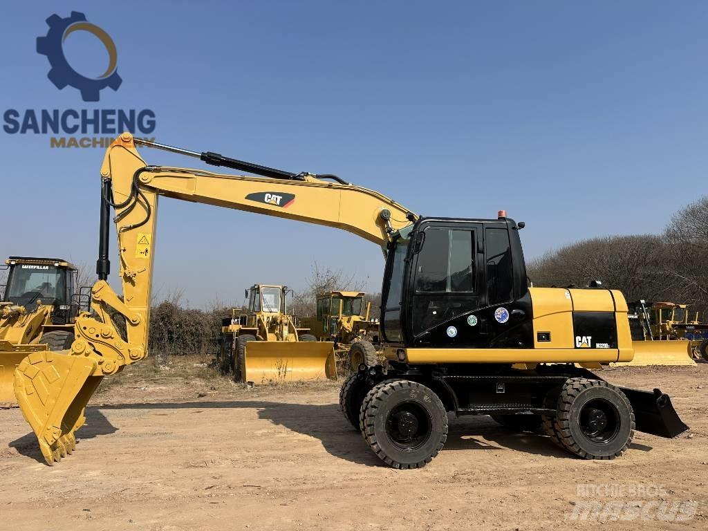 CAT M 320 D2 Колесни екскаватори