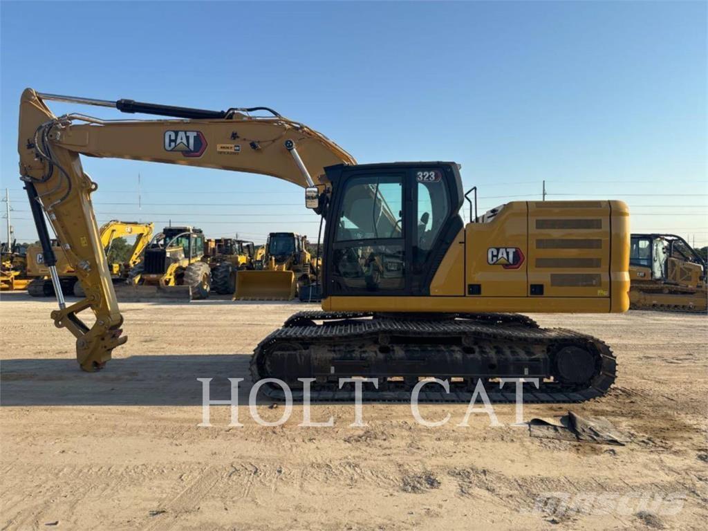 CAT 323 TC Колесни товарачи