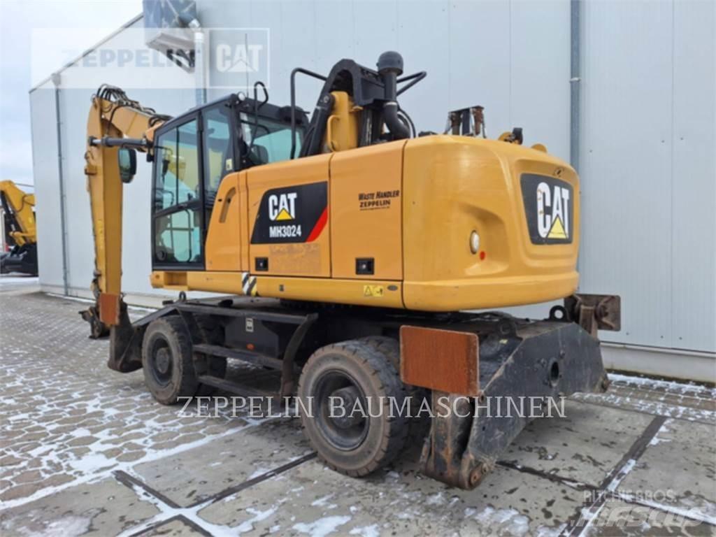 CAT MH3024-06C Багери за разрушаване
