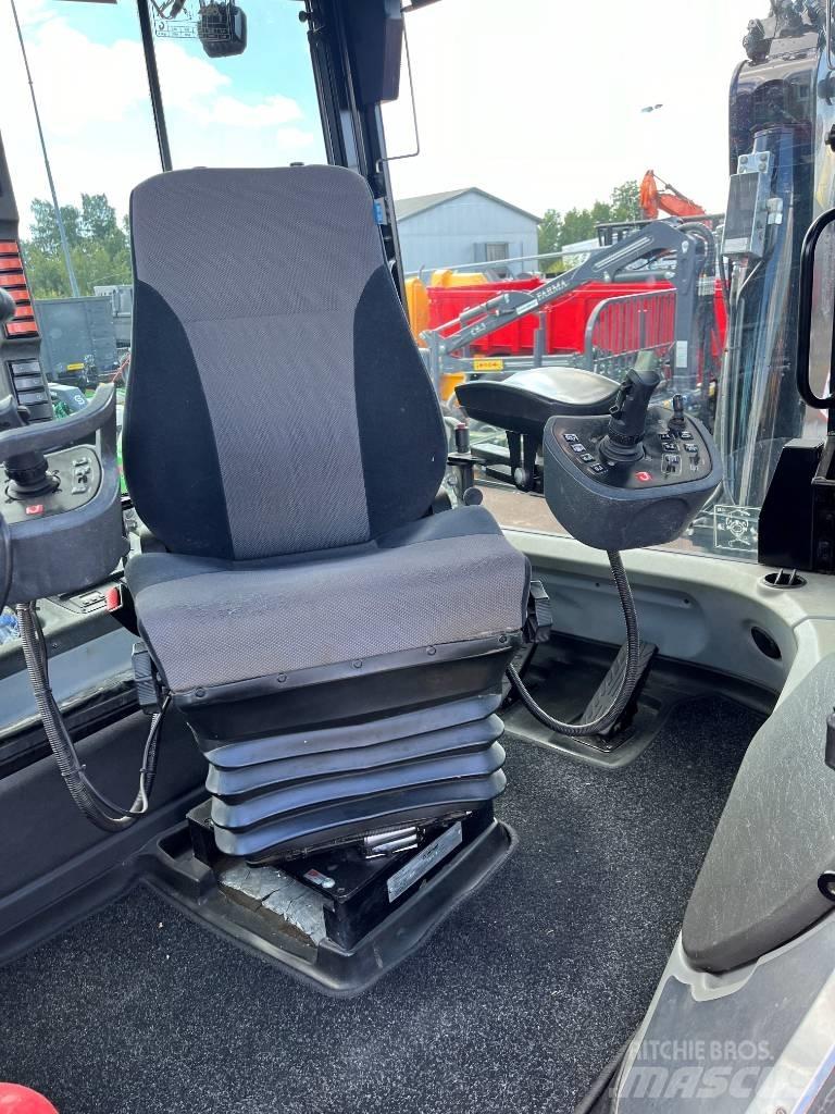 Huddig 1260C City Товарач със заден ексватор