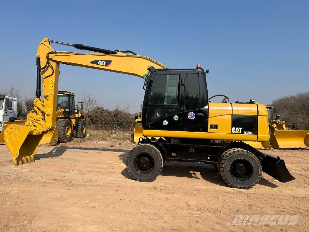 CAT M 320D Колесни екскаватори