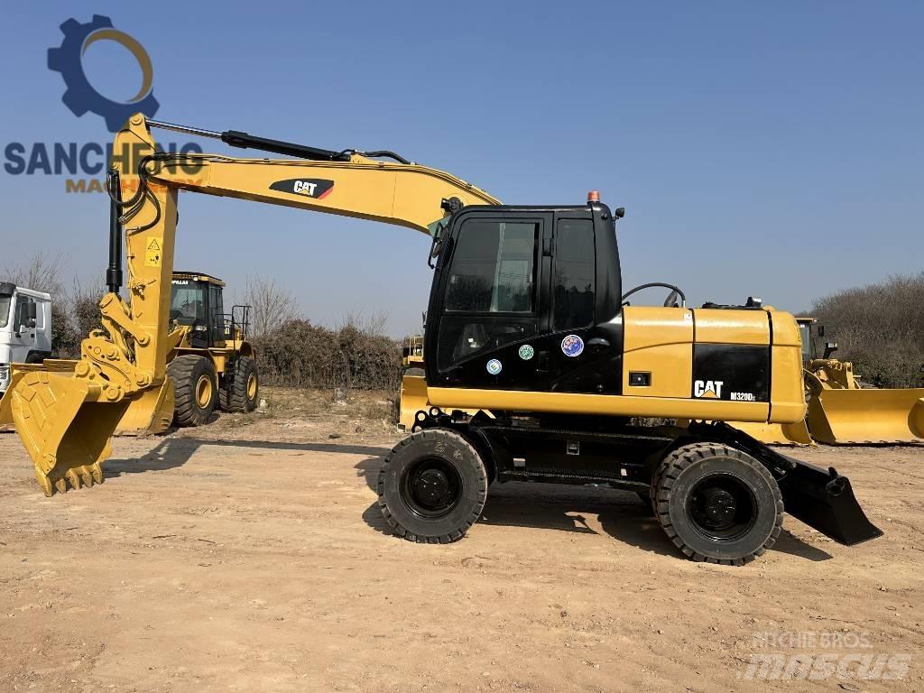 CAT M 320 D2 Колесни екскаватори