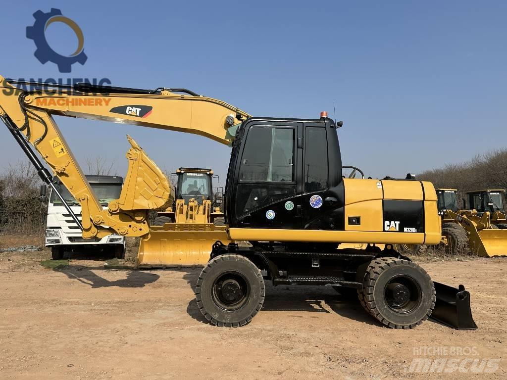 CAT M 320 D2 Колесни екскаватори