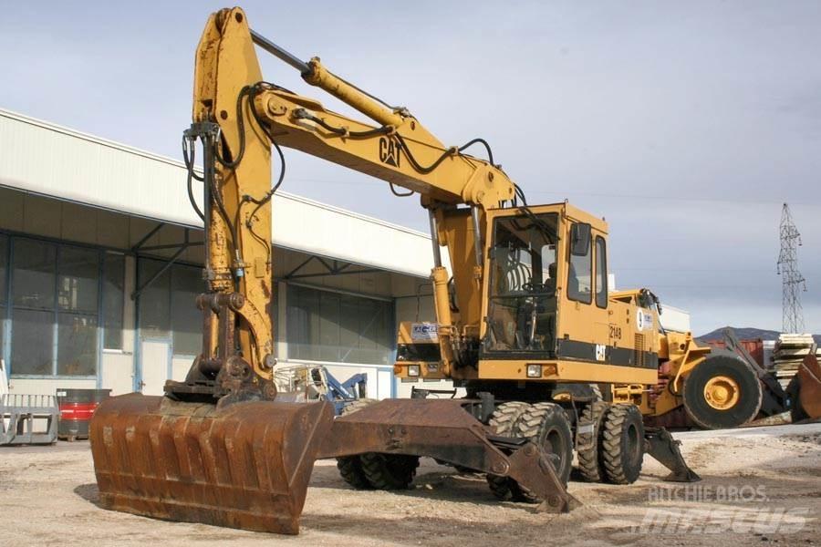 CAT 214B Колесни екскаватори