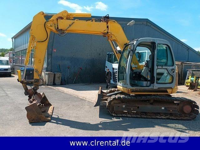 New Holland E70SR 4 Товарач със заден ексватор