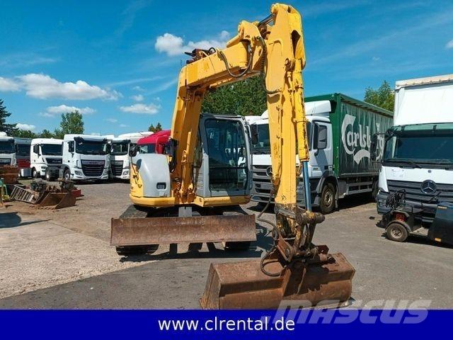 New Holland E70SR 4 Товарач със заден ексватор