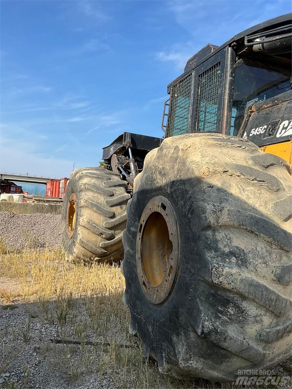 CAT 545C Скидери
